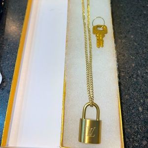 Authentic Louis Vuitton Lock on a 10 karat gold necklace.